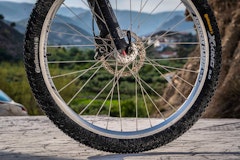 Bicycle wheel with view of the Almeria in the background