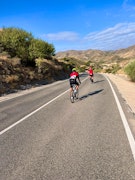 Two cyclists on the road in Almeria